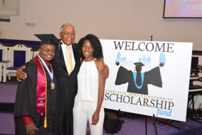 Dr. John T. Crawford, founder of Greater Steps Scholars, poses with recent graduates.